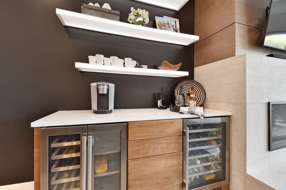 Coffee & Beverage Bar Adjacent to the Breakfast Bar and Fireplace