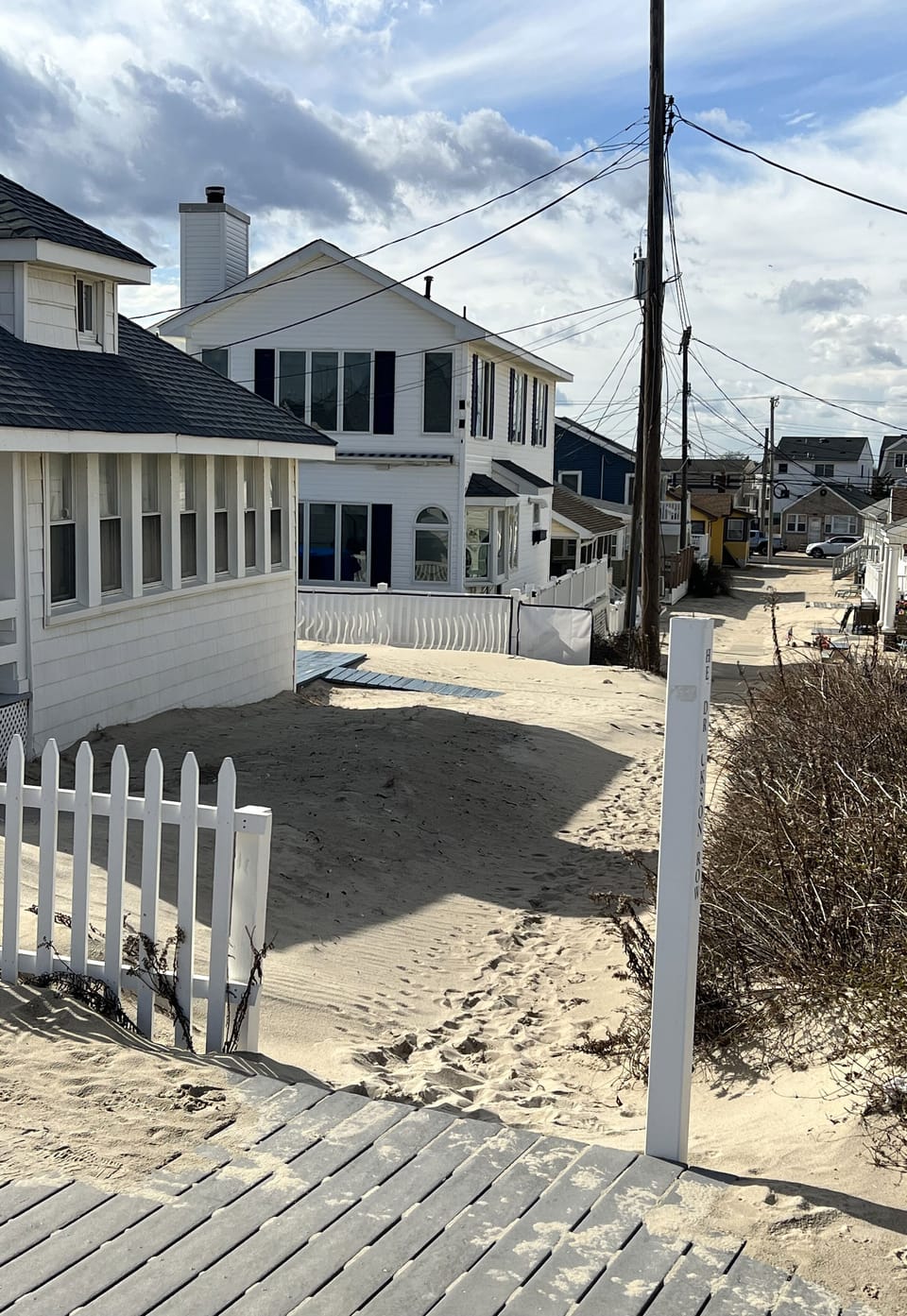 Standing on boardwalk looking at house