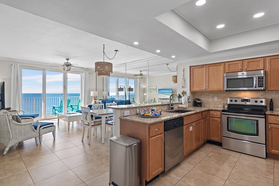 The kitchen features stainless steel appliances and granite countertops and is fully stocked so you can prepare meals while enjoying those Gulf views!