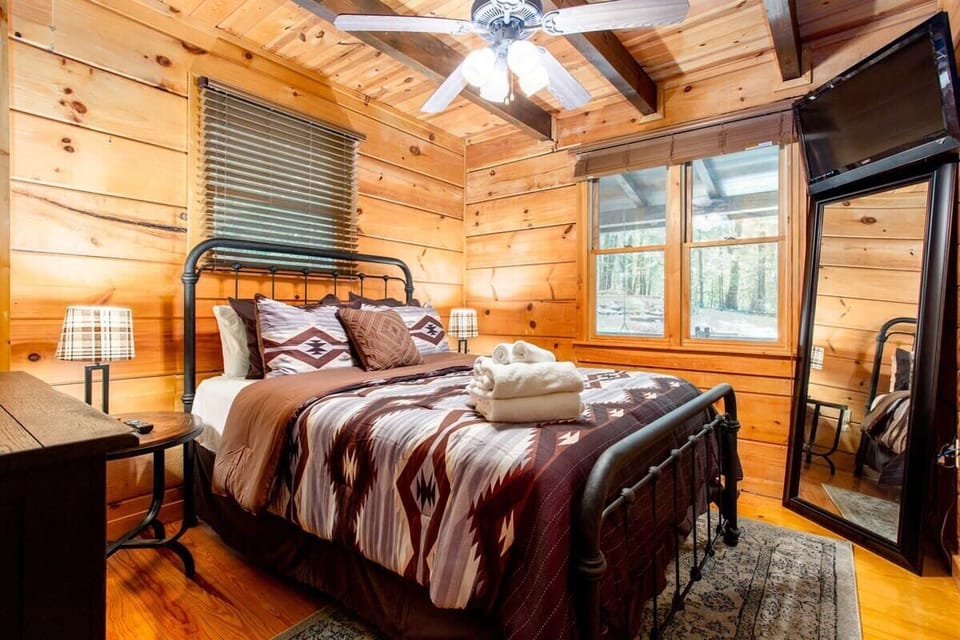 Main floor bedroom area with Queen bed and large closet.