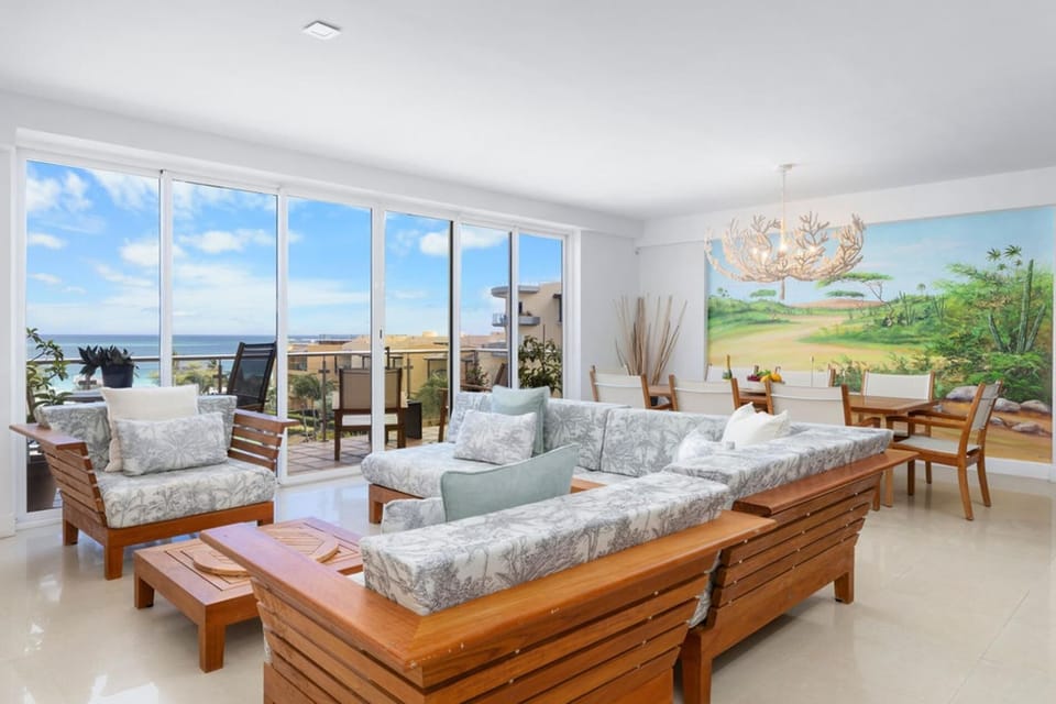 Unwind in style and enjoy a chic living room with modern furniture and seamless access to a private balcony.