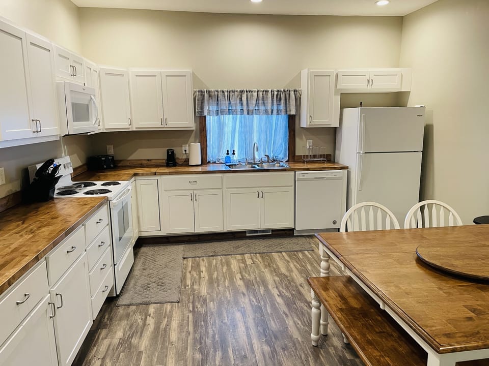 Large fully stocked eat-in kitchen.