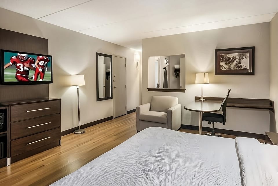 Kick back with in-room TV, desk, and lounge chair.