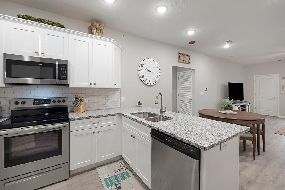 Clean, modern kitchen with plenty of counter space for prepping meals