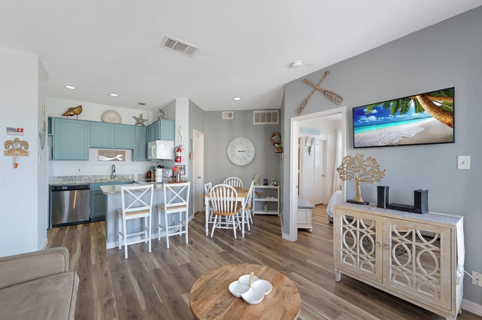 Your bright, coastal-themed retreat features turquoise cabinets and nautical touches that make you feel instantly at home.