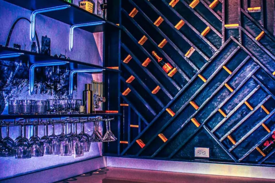 Mix your favorite drink in the bar with custom wine bottle display.. 