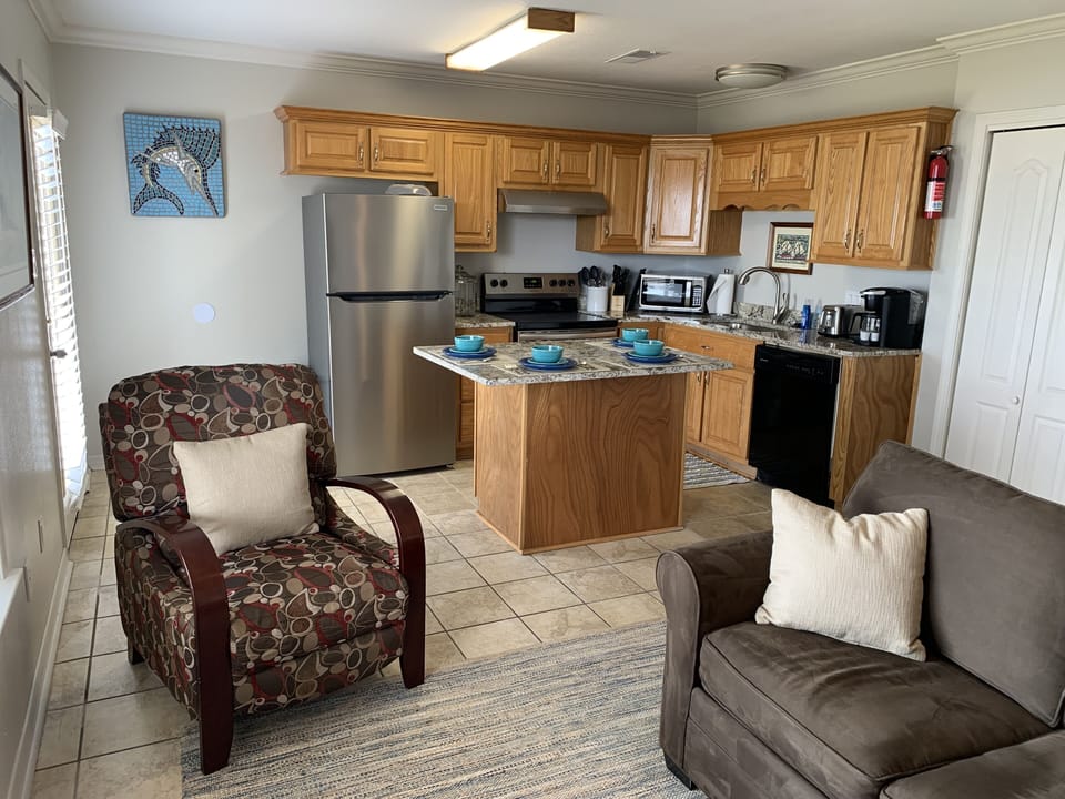 Living and Kitchen Area Showing Recliner