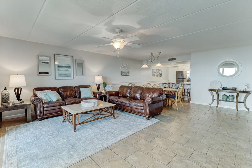 331 Amelia By The Sea- Beautiful Living Space with Magnificent Ocean and Pool Views, a Large Flat Screen Smart TV, and a Slider to the Terrace