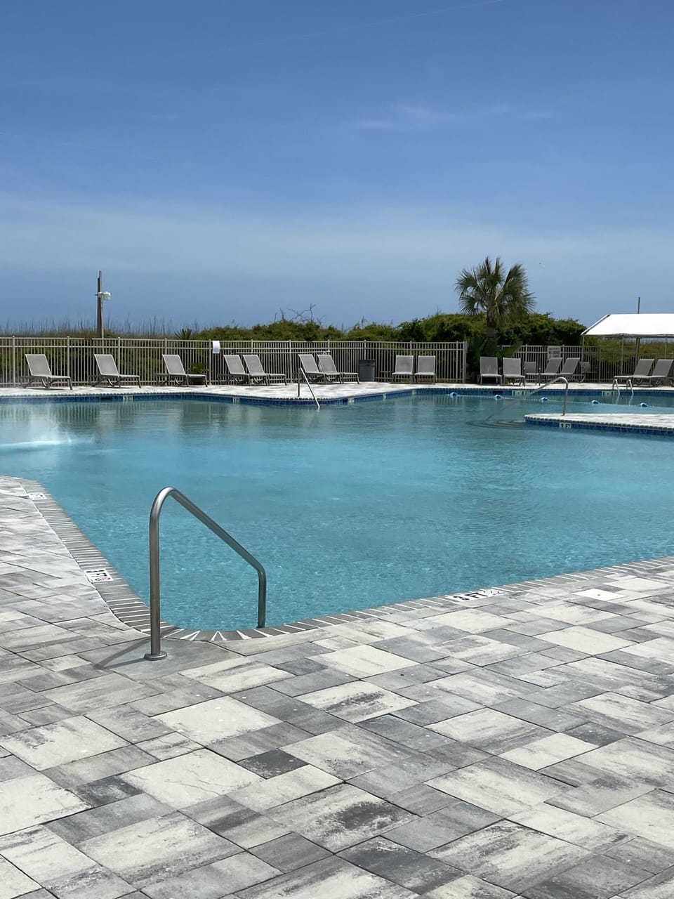 Large swimming pool at the resort, kiddie pool next to it