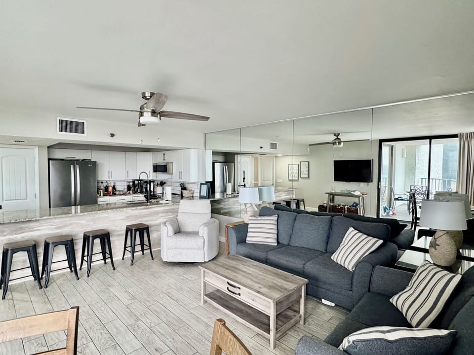 Living room with queen sofa and recliner. 