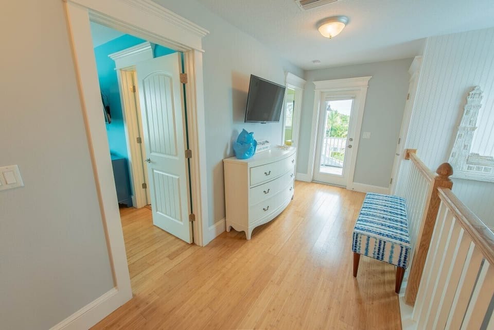 3rd level hallway with door leading to rooftop deck