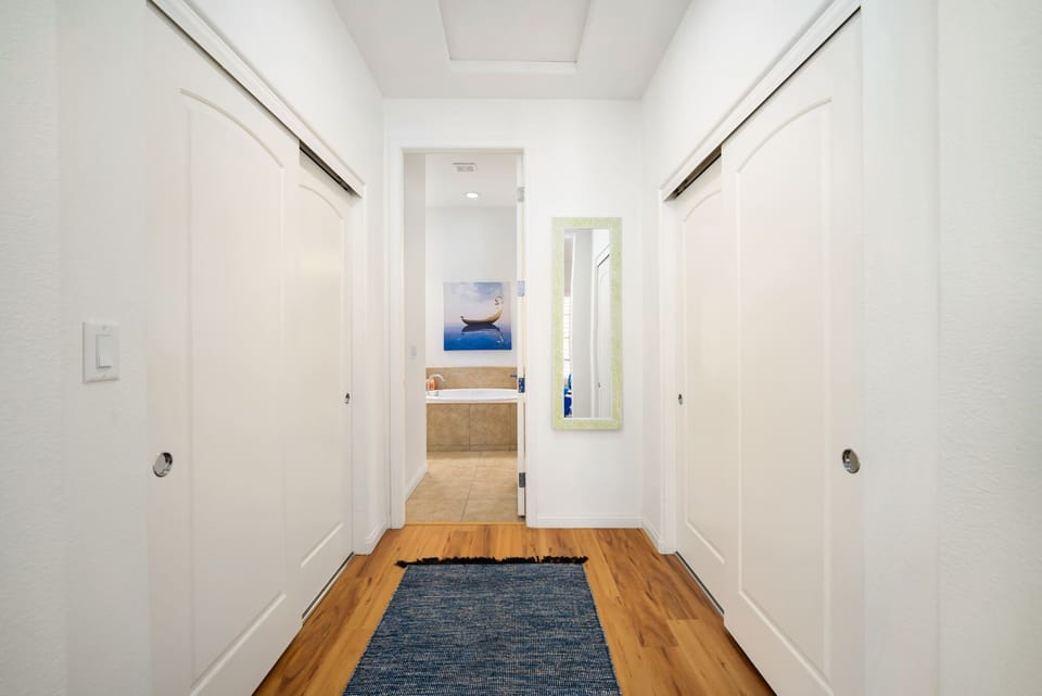 King Suite dressing area with two double sliding door closets. Tons of storage.