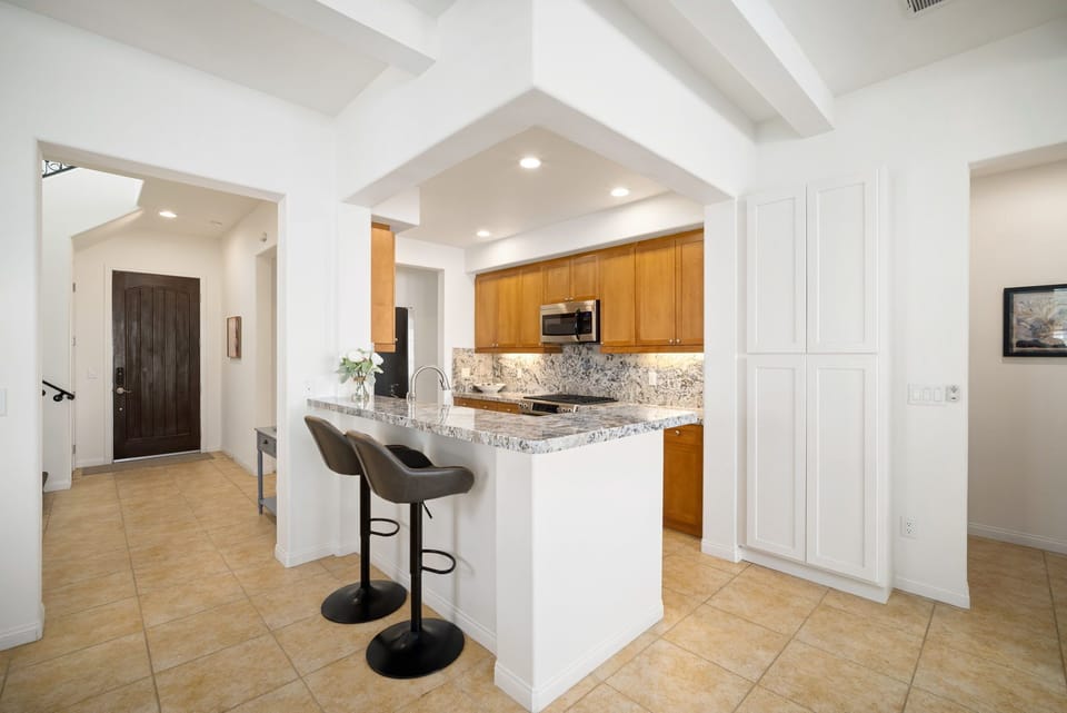 Kitchen counter with bar stools for fun morning conversations at breakfast.