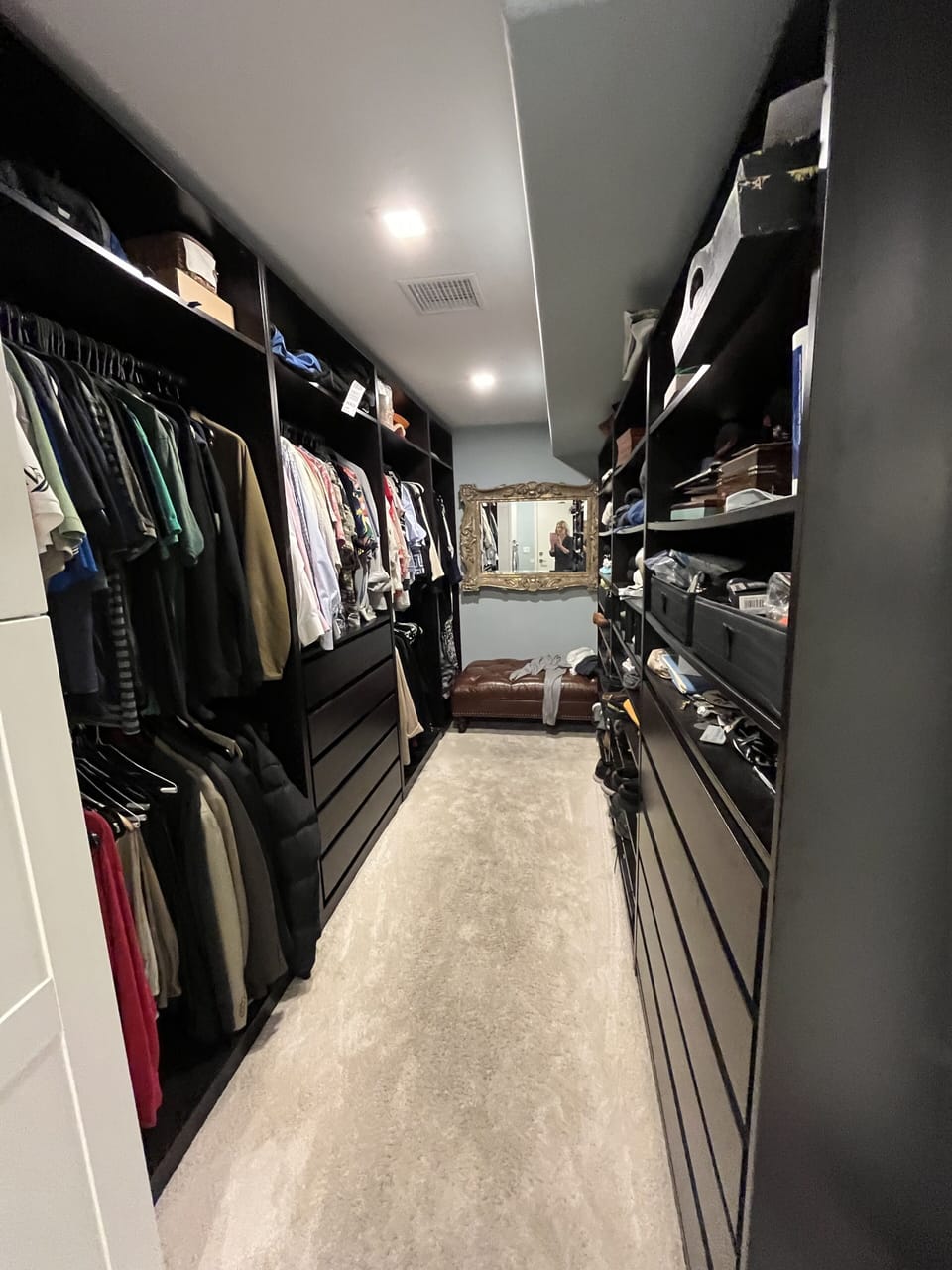 Master closet with lots of drawers, shelfs and hanging