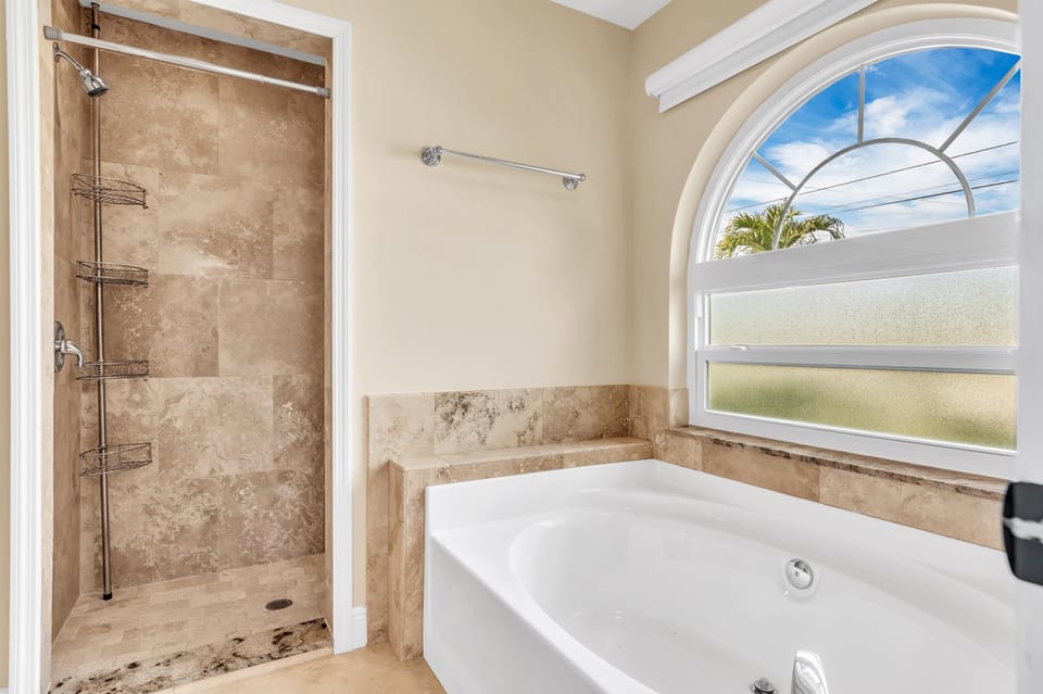 Spa-like retreat with a deep soaking tub and custom walk-in shower!