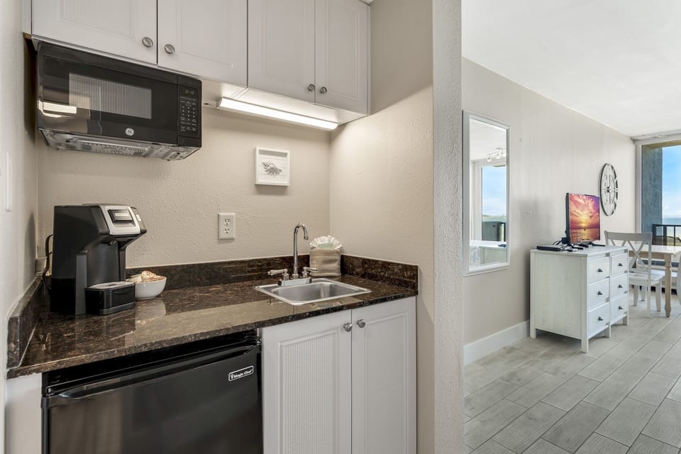 Kitchenette with microwave, mini fridge, coffee machine,