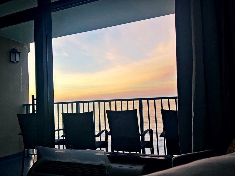 Morning light settles over the water as the sun comes up.