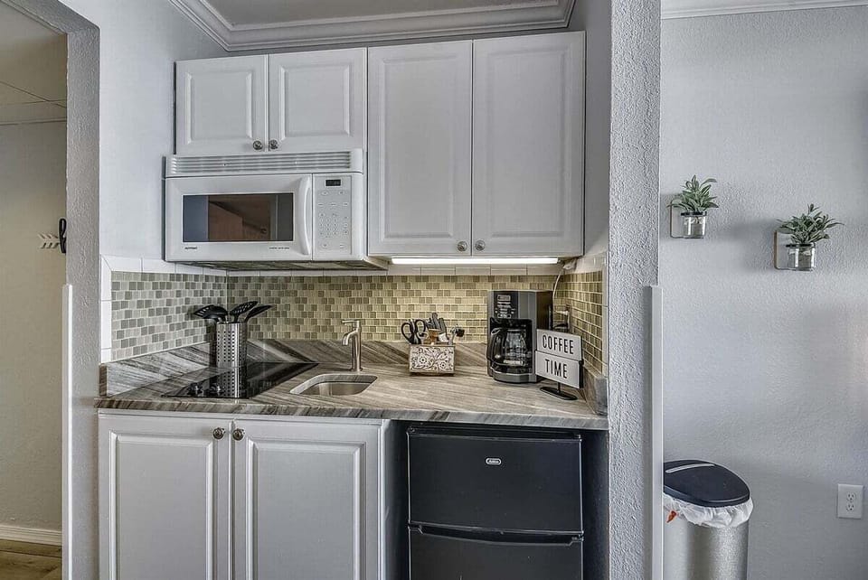 A neatly arranged kitchenette keeps everything within easy reach.
