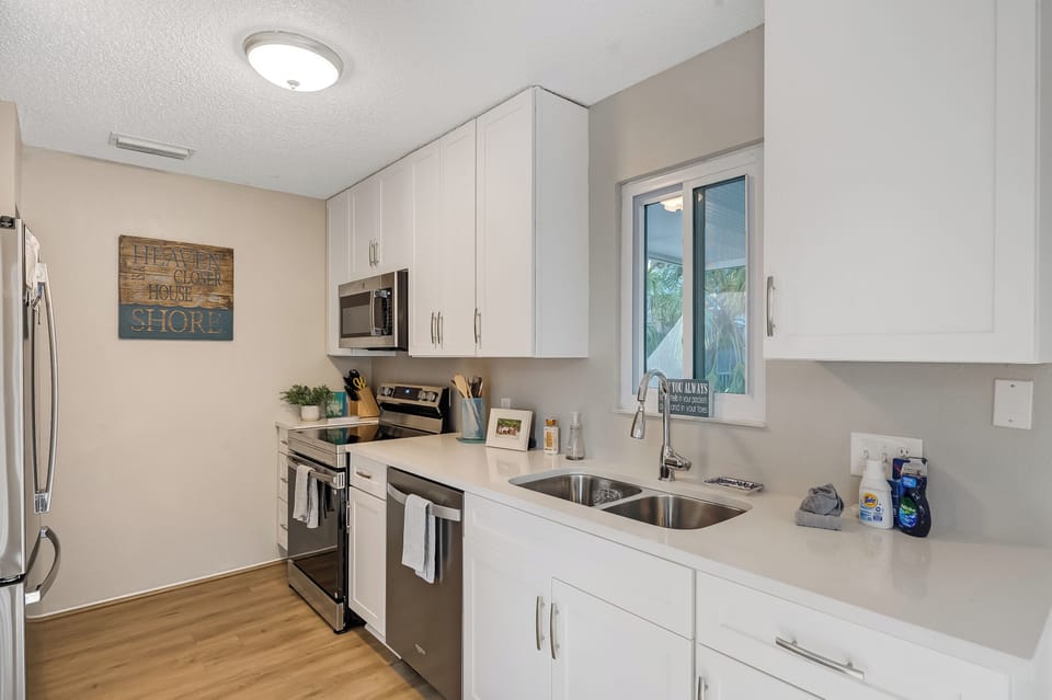 Newly remodeled kitchen with new cabinets and stainless appliances