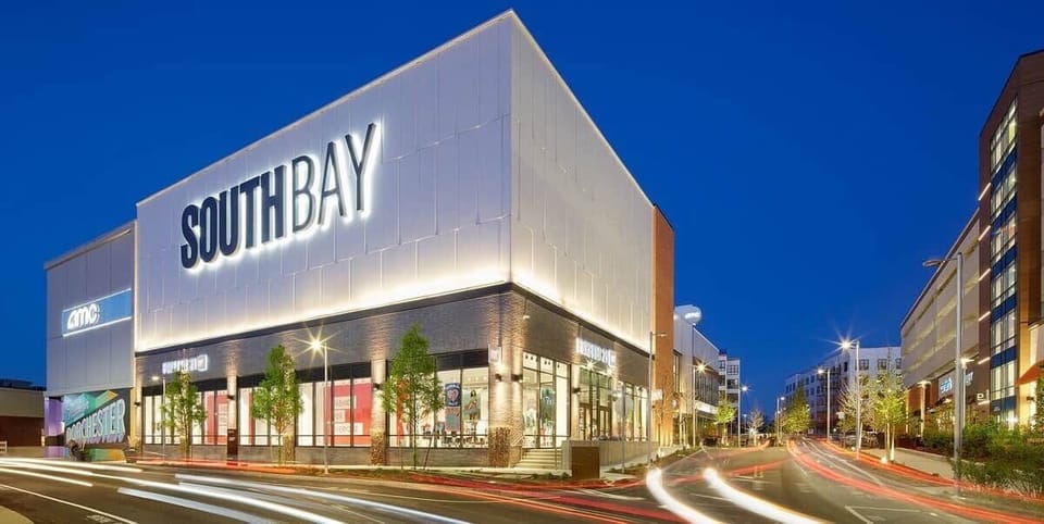 Local shopping center with eateries and shops. Close to highway and accessible by public transportation.