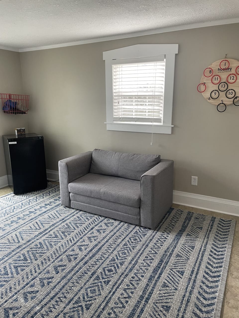 Bonus room off of Kitchen with flip chair and  small fridge.