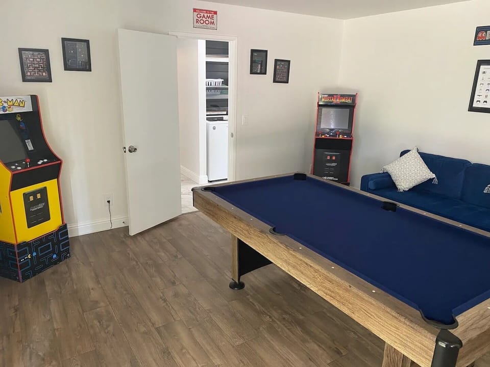 Visit our game room with a pool table and classic arcade games