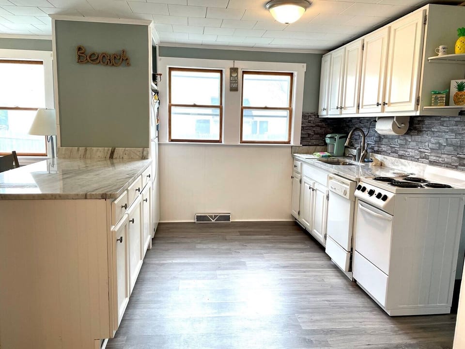 Fully stocked kitchen, with full size fridge, freezer, stove, oven, Keurig, etc.