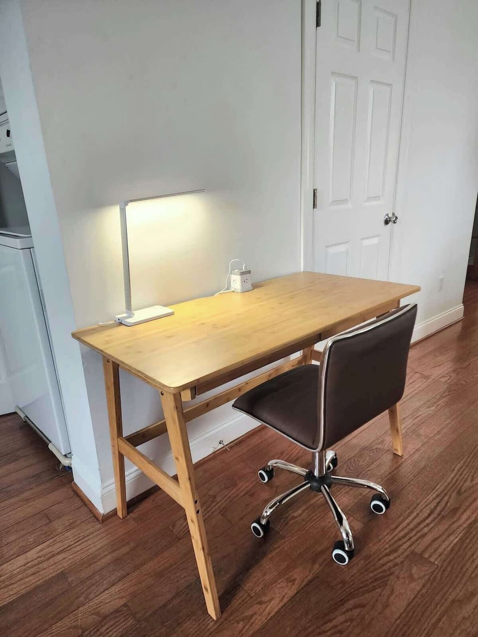 Dedicated workspace on first floor with power strip and task lighting