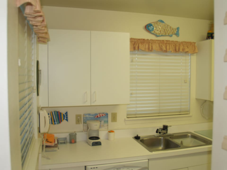 Fully stocked kitchen with pots, pans, cooking&eating utensils,cups,plates,bowls