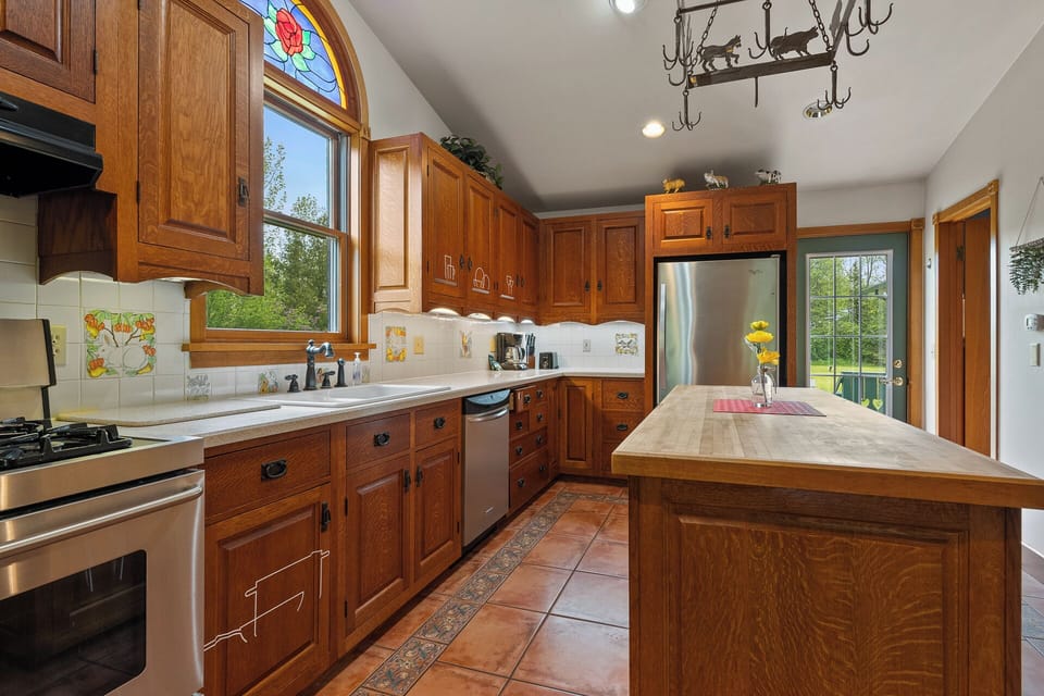 Spacious fully equipped kitchen with island to prepare family meals