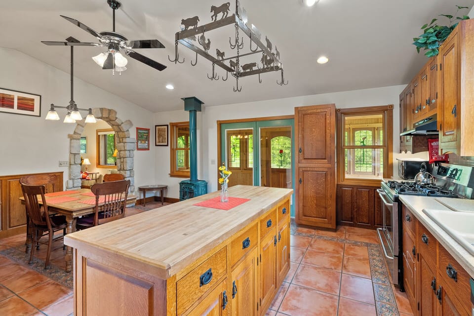 Spacious fully equipped kitchen with island to prepare family meals
