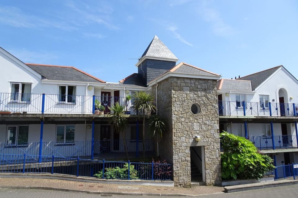 The back of the apartment block with secure gated parking.