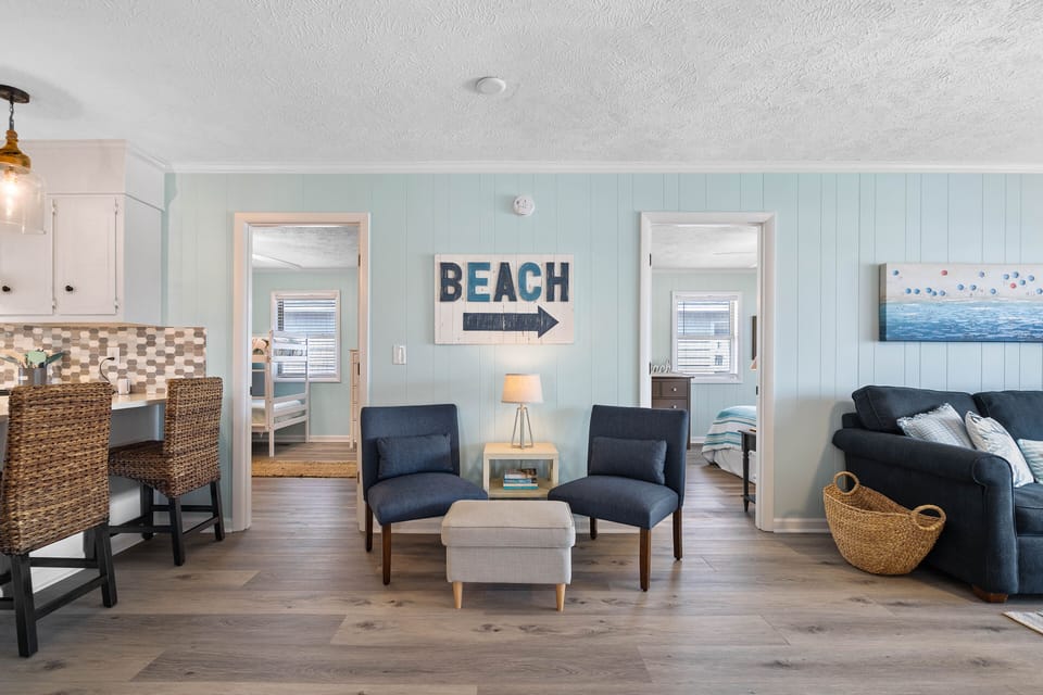Cozy sitting area for two with fun beach decor.