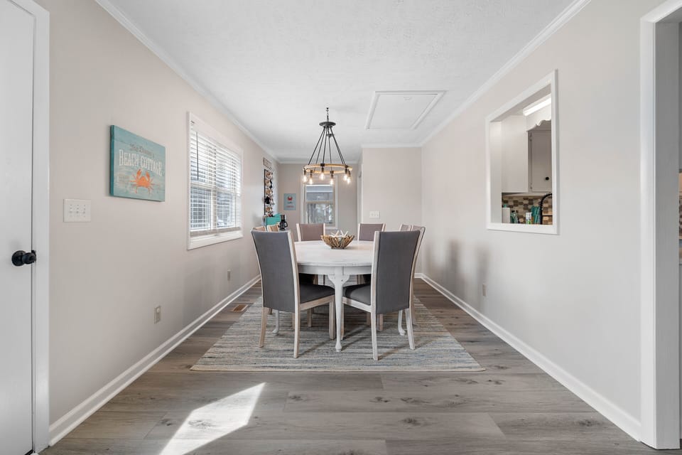 Light and bright dining space with seating for 8.