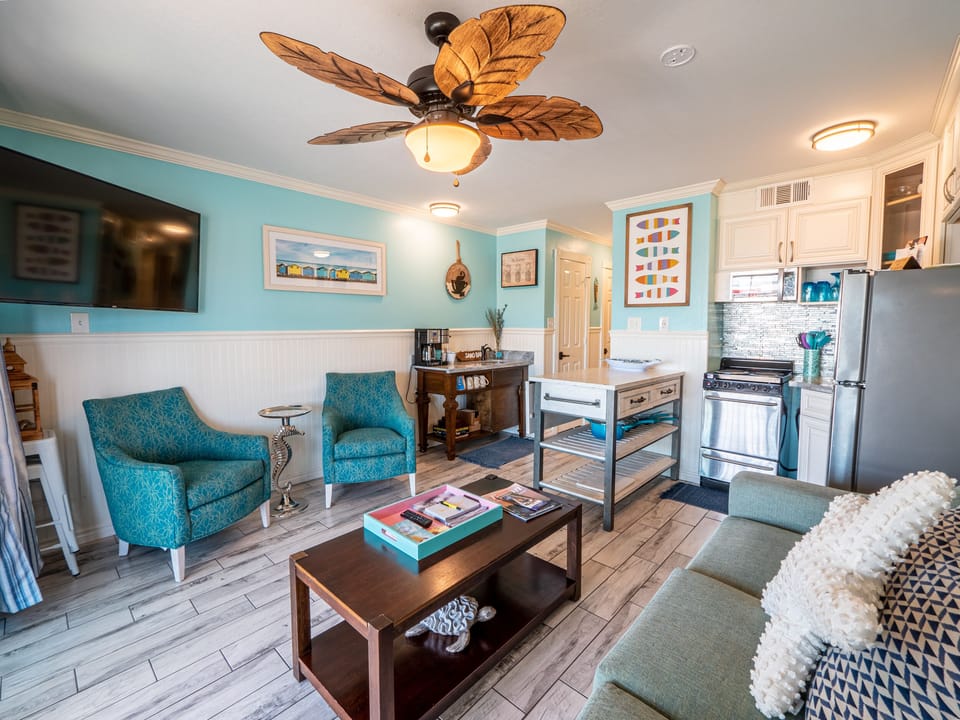 Living Area - From the large, elegant windows to the attractive furniture, you and your guests will love spending time together in this bright and airy living area.