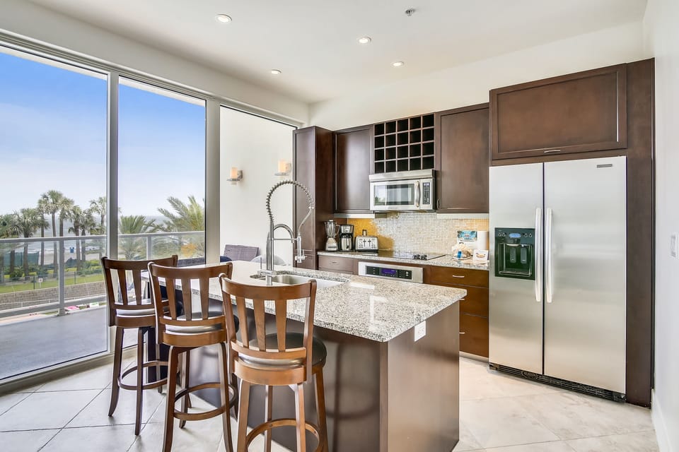 A Fully Loaded Kitchen -  With this full spread of a refrigerator, stove, and utensils, you'll have everything you need for the gourment.