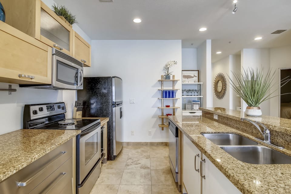 Stainless-steel Means Guest Appeal - The stainless-steel fixtures and appliances add both beauty and function to the kitchen.