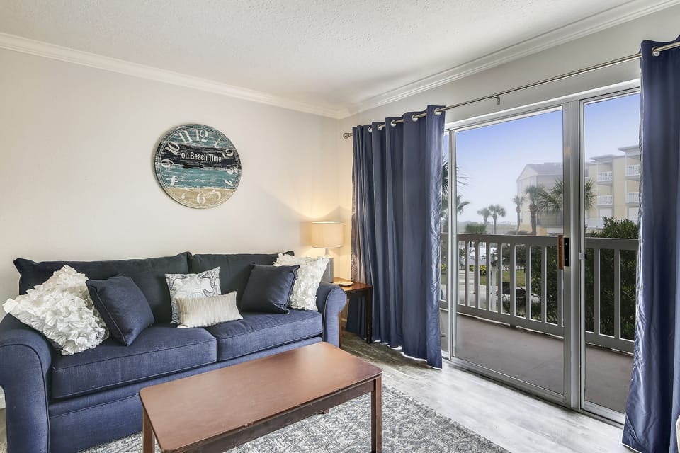 Living Area - From the large, elegant windows to the attractive furniture, you and your guests will love spending time together in this bright and airy living area.