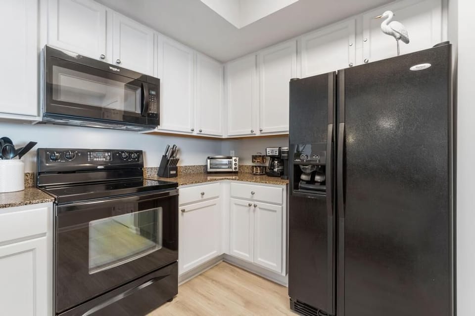 Spacious kitchen with all the comforts of home, Refrigerator with Ice Dispenser.