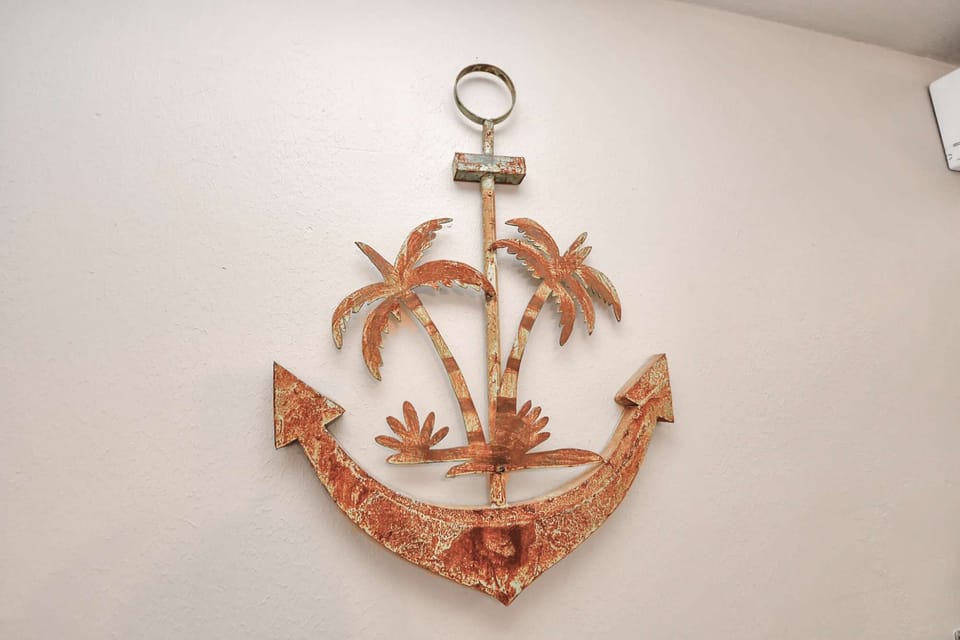Tropical-inspired wall decor bringing warmth &amp; character to the home’s design