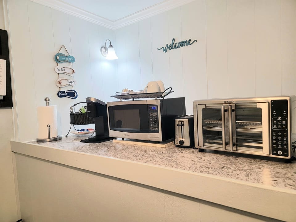 You'll also have a 2 burner cooktop, microwave, toaster and two pans with cooking tools.