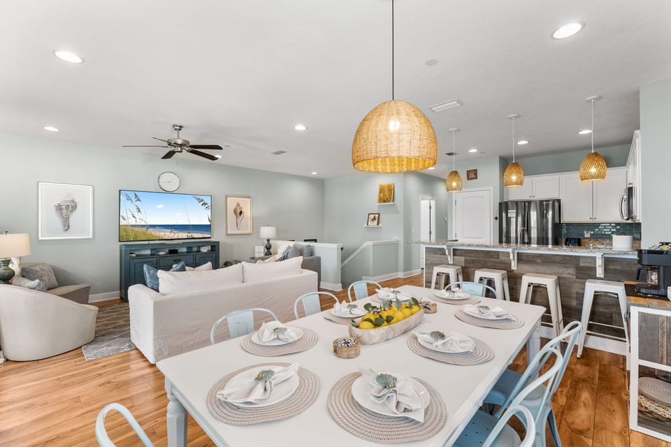NEWLY renovated coastal living space with gorgeous dining table that seats 8 and seating for 4 at the kitchen bar top