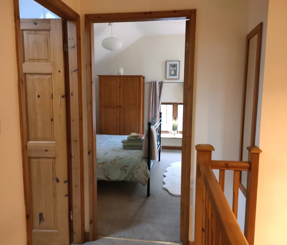 Mezzanine level with bedroom and shower room.