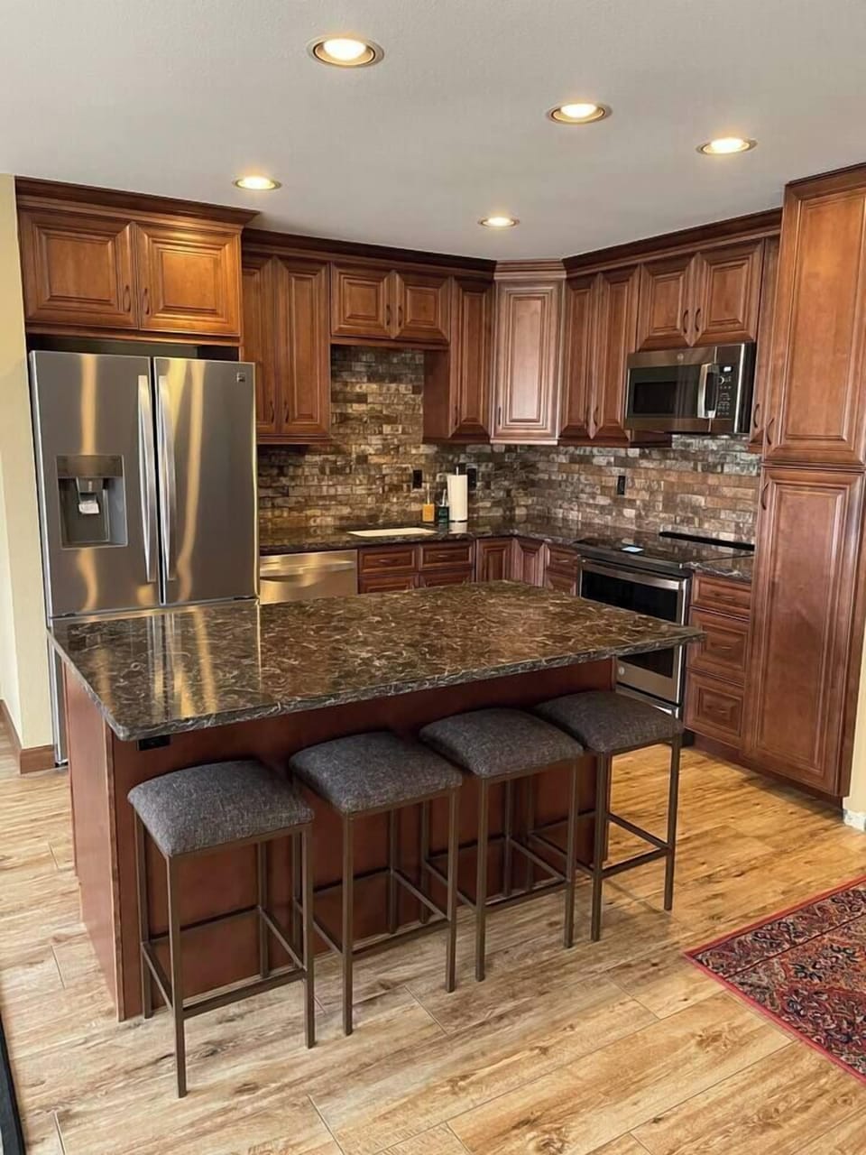 Kitchen with quartz counter tops and an induction range