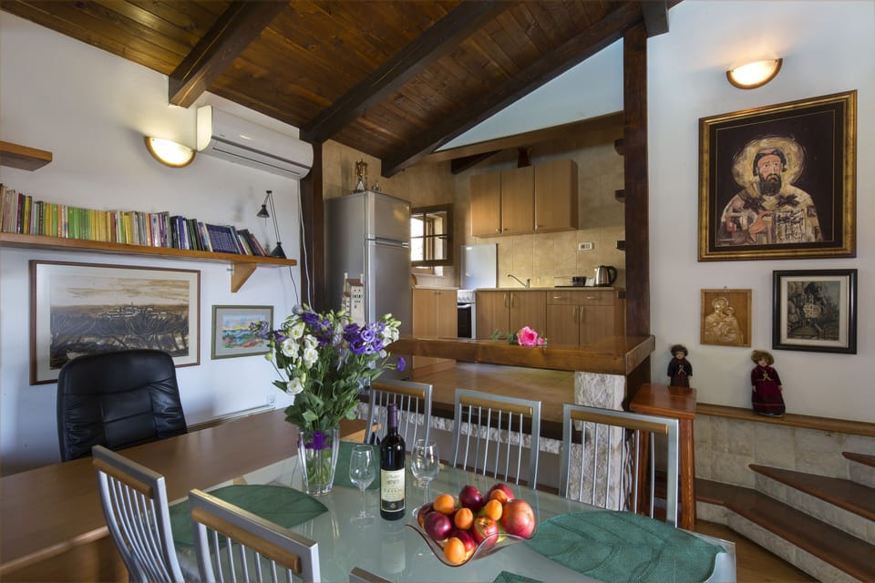 Beside the kitchen guests can use large dinning table.
