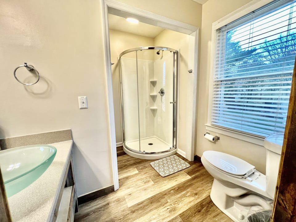 Pamper yourself in the inviting bathroom with a modern shower cabin.