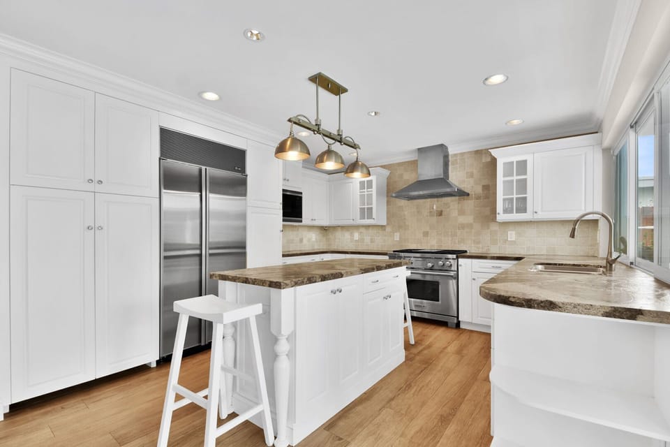 Open plan kitchen is immaculately clean for your arrival