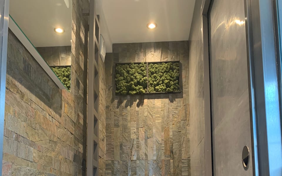 WC, slate walls, concrete lined sliding door and Swedish moss