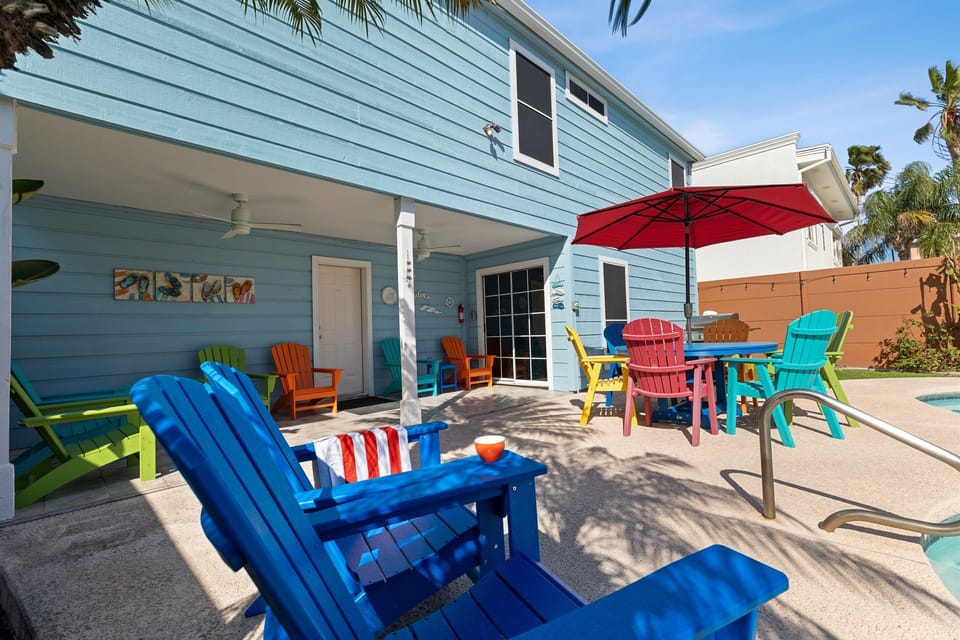 Step into the backyard oasis, complete with plenty of outdoor furniture and a dining table for al fresco meals.
