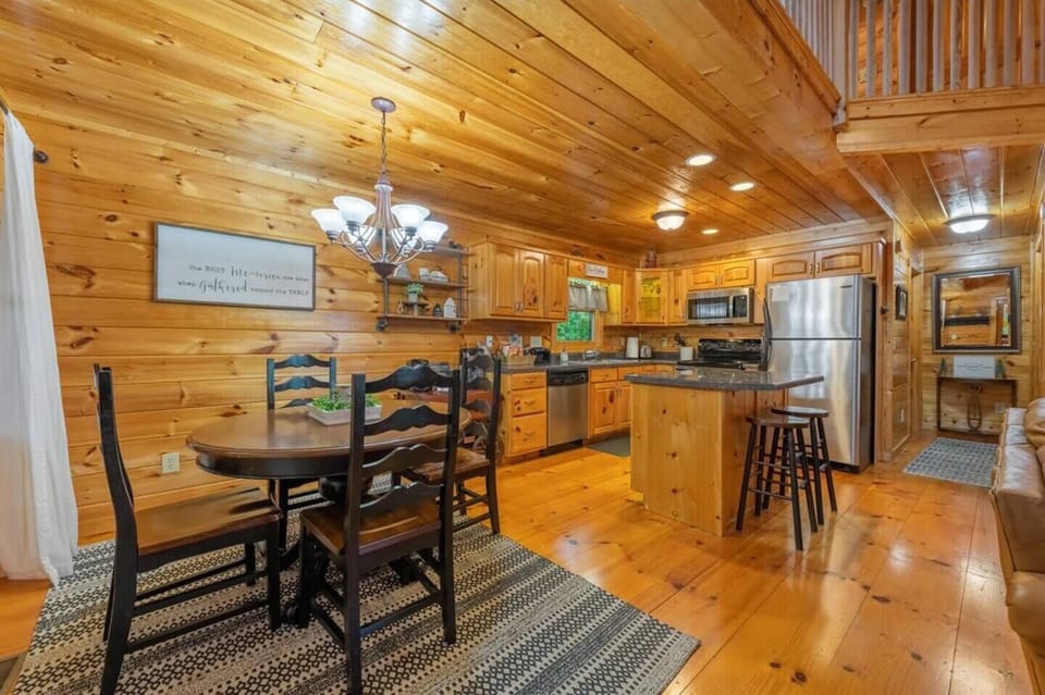 Discover another angle of the kitchen area, offering a comprehensive view that includes the dining table.